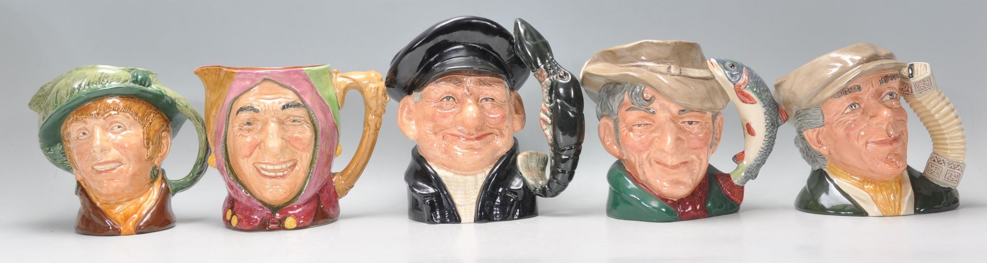 A group of five Royal Doulton ceramic Character / Toby jugs to include The Busker D6775, Appiet,