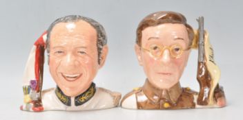 A pair of Royal Doulton Carry On series character jugs to include Sid James D7161 (limited edition