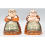 A pair of Royal Doulton salt and pepper pots entitled 'Votes for Women' and 'Toil for Men', D7066