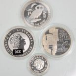 A group of four fine silver Dollar coins to include 2013 5 Dollar New Zealand Queen's Diamond