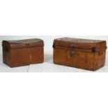 Two vintage mid 20th Century metal travelling trunks both retaining original brown paint work with
