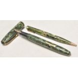 Two vintage green celluloid writing pens to include one fountain pen and one mechanical ballpoint