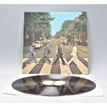 A vinyl long play LP record album by The Beatles – Abbey Road – Original Apple Records 1st U.K.