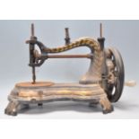 A 19th Century Victorian Jones Empress of India cat back sewing machine of serpentine form, raised