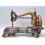 A vintage early 20th Century cast iron sewing machine by Jones 'The Lightning Hand Machine' having