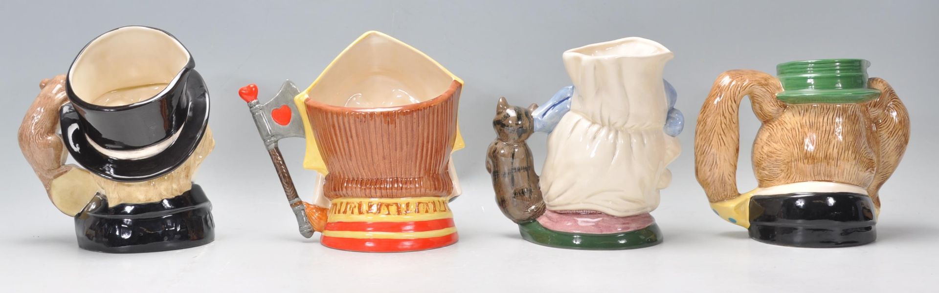 A group of four Royal Doulton ceramic character jugs to include Mad Hatter C6598, The March Hare D - Bild 3 aus 7