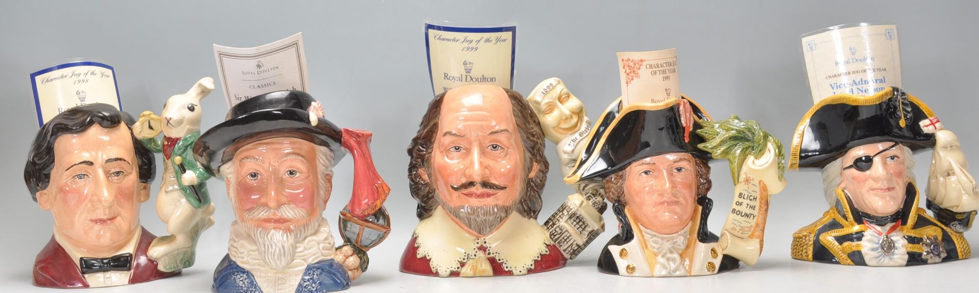 A group of five Royal Doulton ceramic character jugs to include Lewis Carroll D7096, Sir Walter