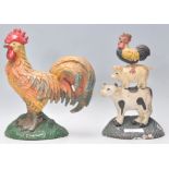 A 20th century cast iron doorstop in the form of a cockerel together with another having cow, pig,