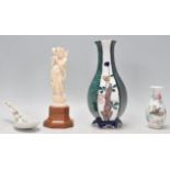 A collection of Chinese ceramics to include a waisted vase having alternate panelled sides being