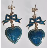 A pair of stamped silver ladies Georgian style drop earrings in the form of hearts with bows to