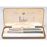 A vintage set of Parker writing pens complete in their original box to include one writing ink pen