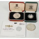 A group of four fine silver coins to include 'The Longest Reigning Monarch' £20 coin, 2x 1977 silver