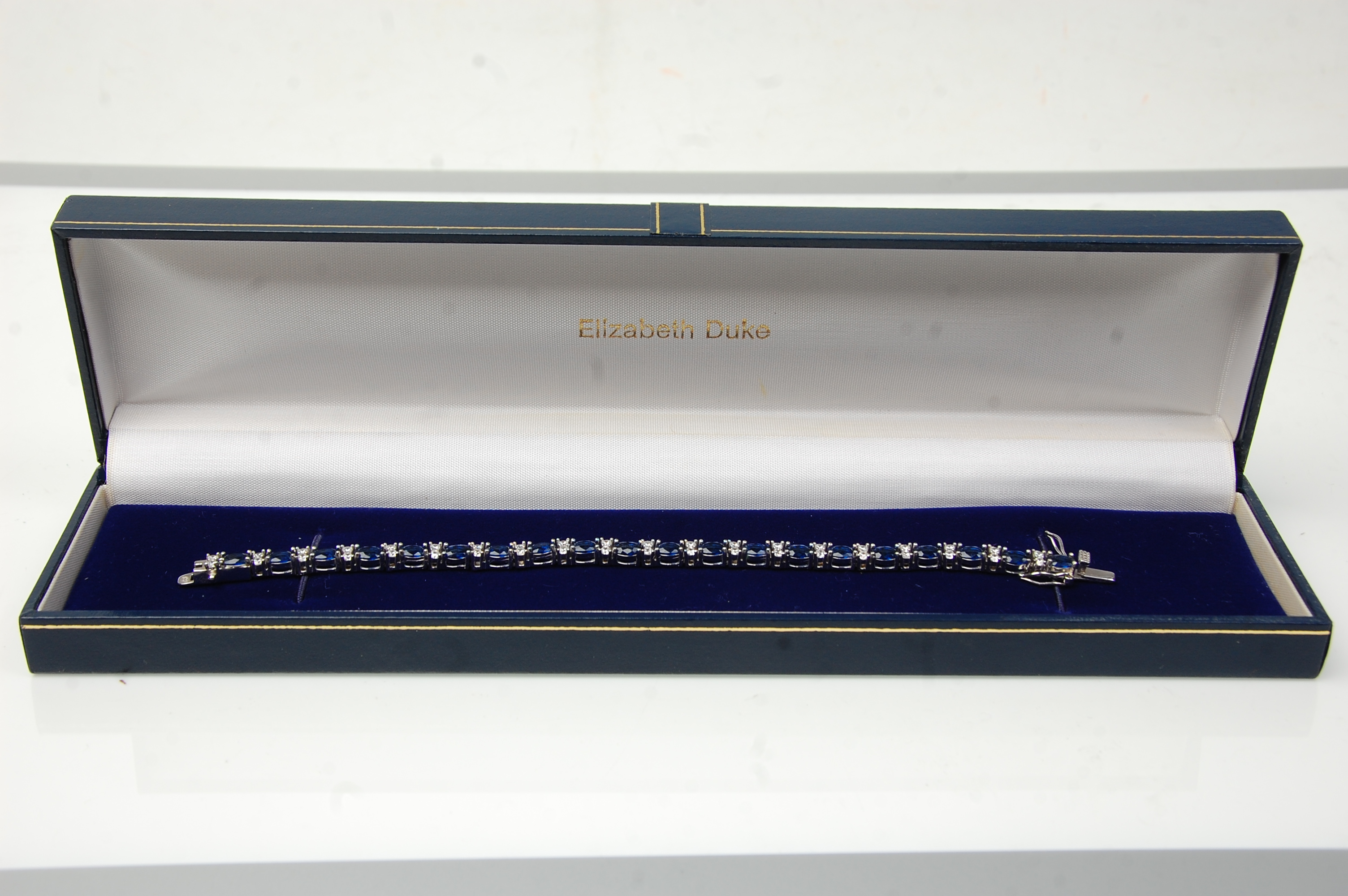 A stamped 925 silver tennis bracelet being set with oval cut blue stones with round cut white - Image 5 of 5