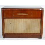 A 1940's walnut veneered cased floor standing Regentone record player radiogram raised on a plinth