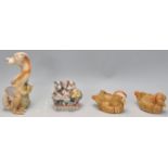 A group of four Harmony Kingdom cast resin figurines to include Tamira's Treasure,  House Party (