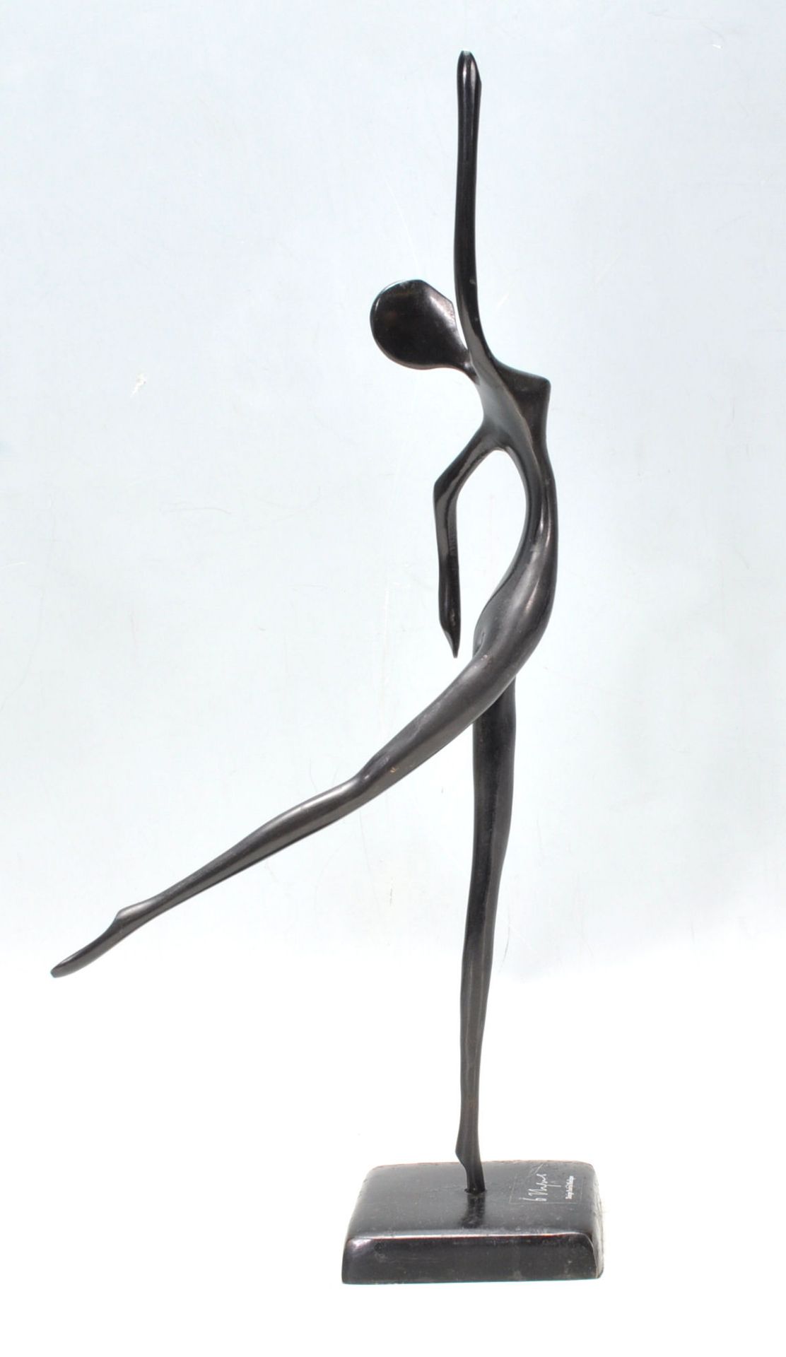 A Bodrul Khalique cast bronze figural sculpture ornament depicting an elongated abstract female