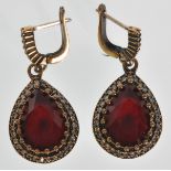 A pair of stamped 925 silver drop earrings in set with teardrop cut rubellite stone with white