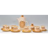 A vintage retro 20th Century Royal Worcester Palissy pattern coffee service compressing of six
