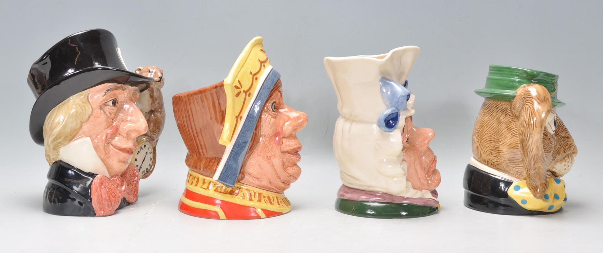 A group of four Royal Doulton ceramic character jugs to include Mad Hatter C6598, The March Hare D - Bild 2 aus 7