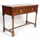 An 18th century revival Jacobean writing table desk. Raised on turned legs united by stretchers