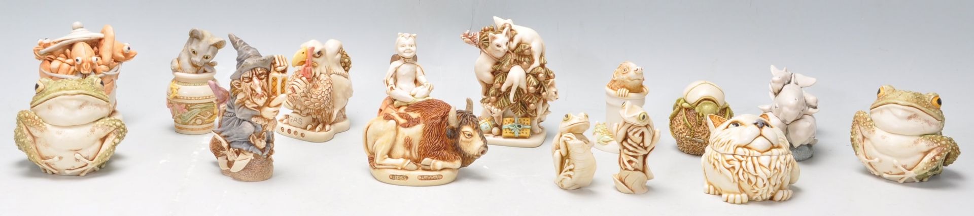 A group of thirteen Harmony Kingdom novelty resin figurines to include cats climbing a Christmas