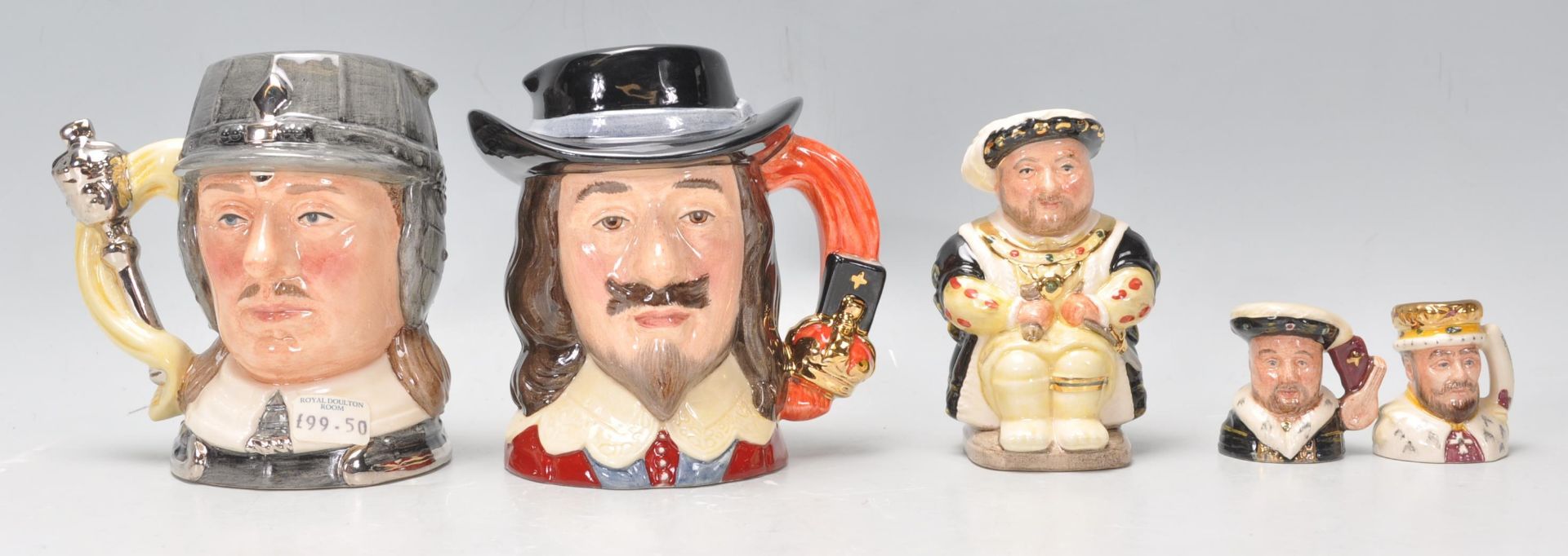 A mixed group of small and large Royal Doulton ceramic Character / Toby jugs to include Oliver