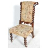 A 19th Century Victorian antique rosewood prie-dieu prayer chair having turned bobbin legs