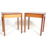 A pair of 1960's Air Ministry type solid teak wood side / lamp tables. Each raised on square