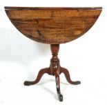 A 19th Century Victorian drop leaf occasional table having a round top raised on a turned knopped