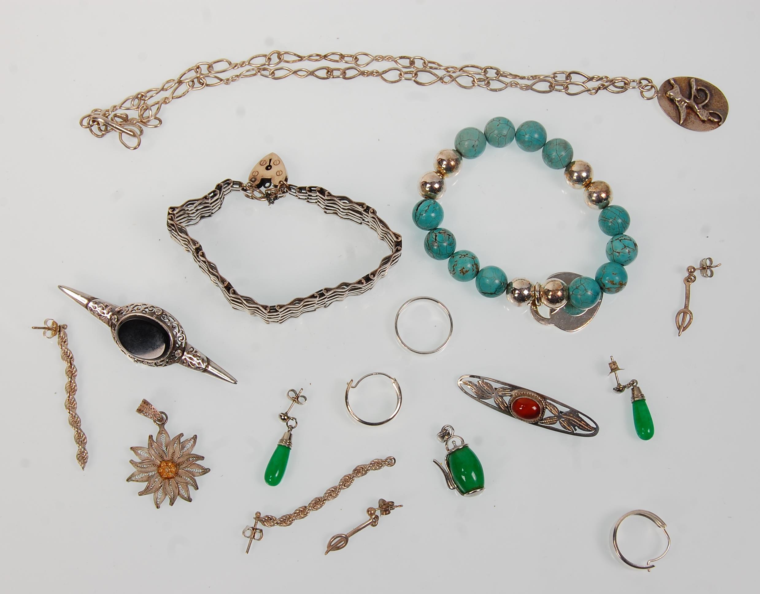 A collection of vintage silver jewellery to include a heart lock gate link bracelet, a silver and
