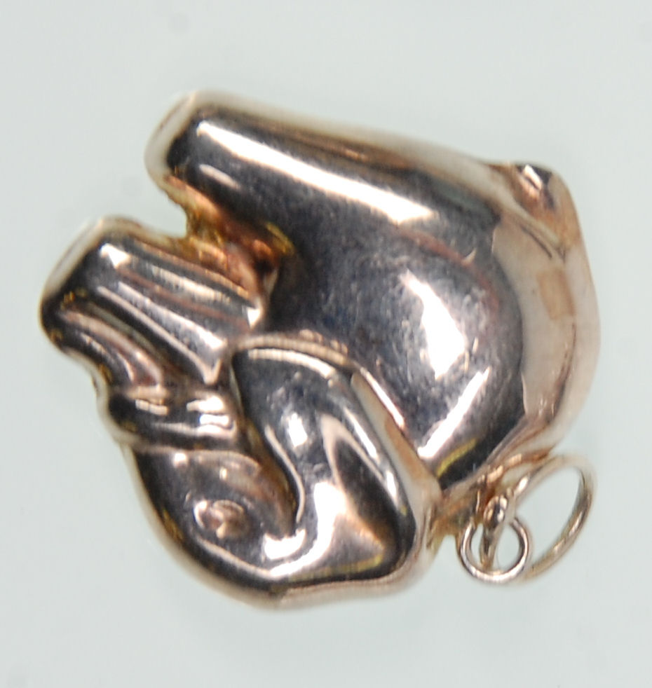 A group of silver chains and pendants to include a large pendant in the form of a hand holding a - Image 3 of 5
