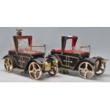 A pair of vintage retro drinks ebonised wooden caddy's in the form of motor cars with fitted