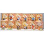 A good group of twelve Royal Doulton ceramic figures from 'The Paddington Bear Collection' to