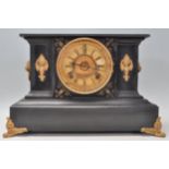A Victorian 19th century marble and gilt metal 8 day mantel clock. The clock being raised on