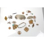 A collection of vintage 20th century fashion jewellery brooches and belt buckles to include a