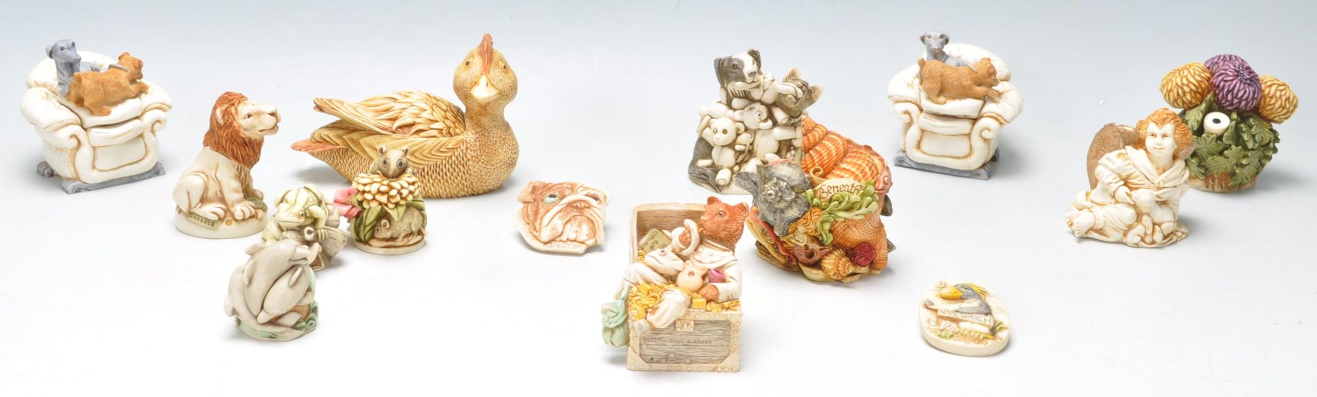 A collection of Harmony Kingdom resin novelty figurines to include a bull dog box, field mouse