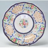 A 19th Century Chinese polychrome plate for the Persian market, decorated with a peony to the