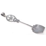 A stamped 925 silver caddy spoon having a pierced decoration finial with reeded decoration, with a