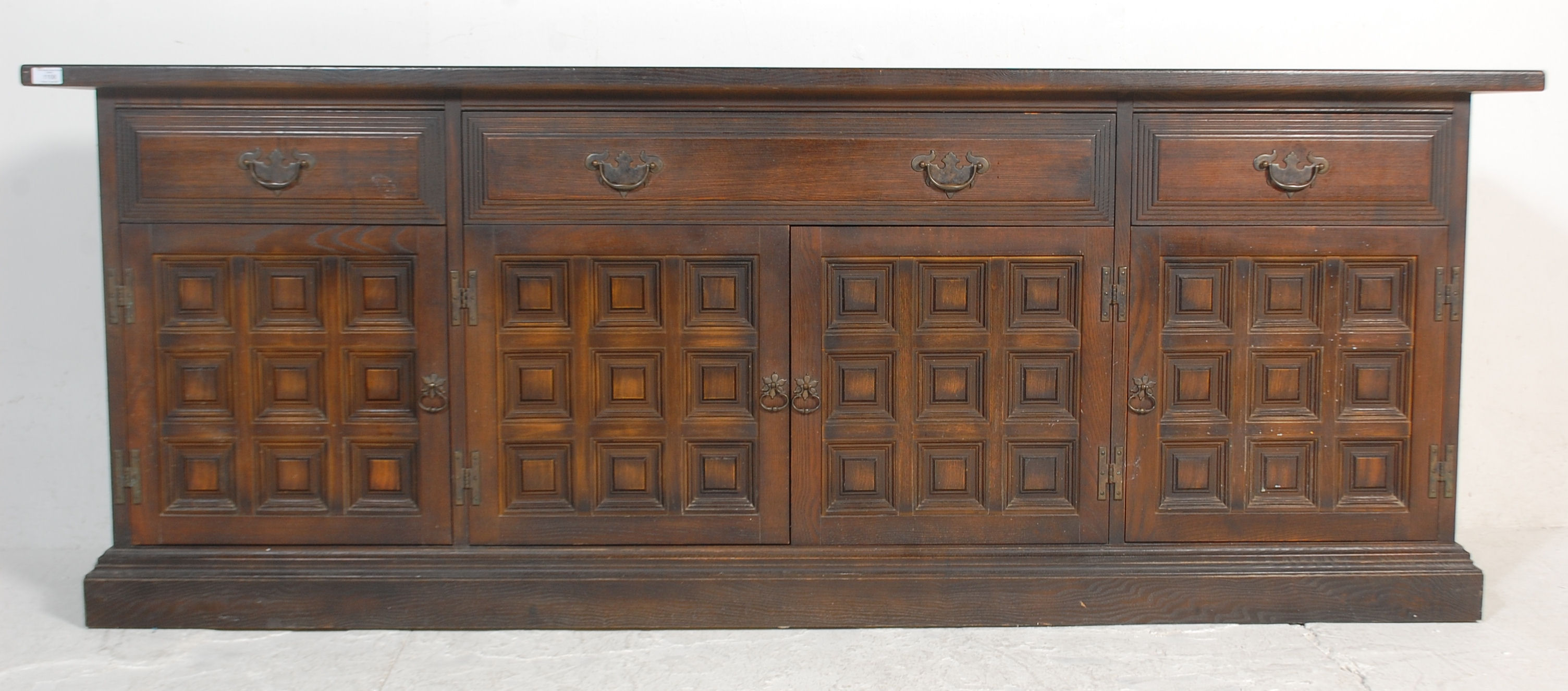 A mid century Spanish influence large carved oak sideboard / dresser base with portcullis relief - Image 3 of 9