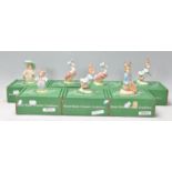 A group of seven Beswick Beatrix Potter ceramic figurines to include Benjamin Button, Tom Kitten,