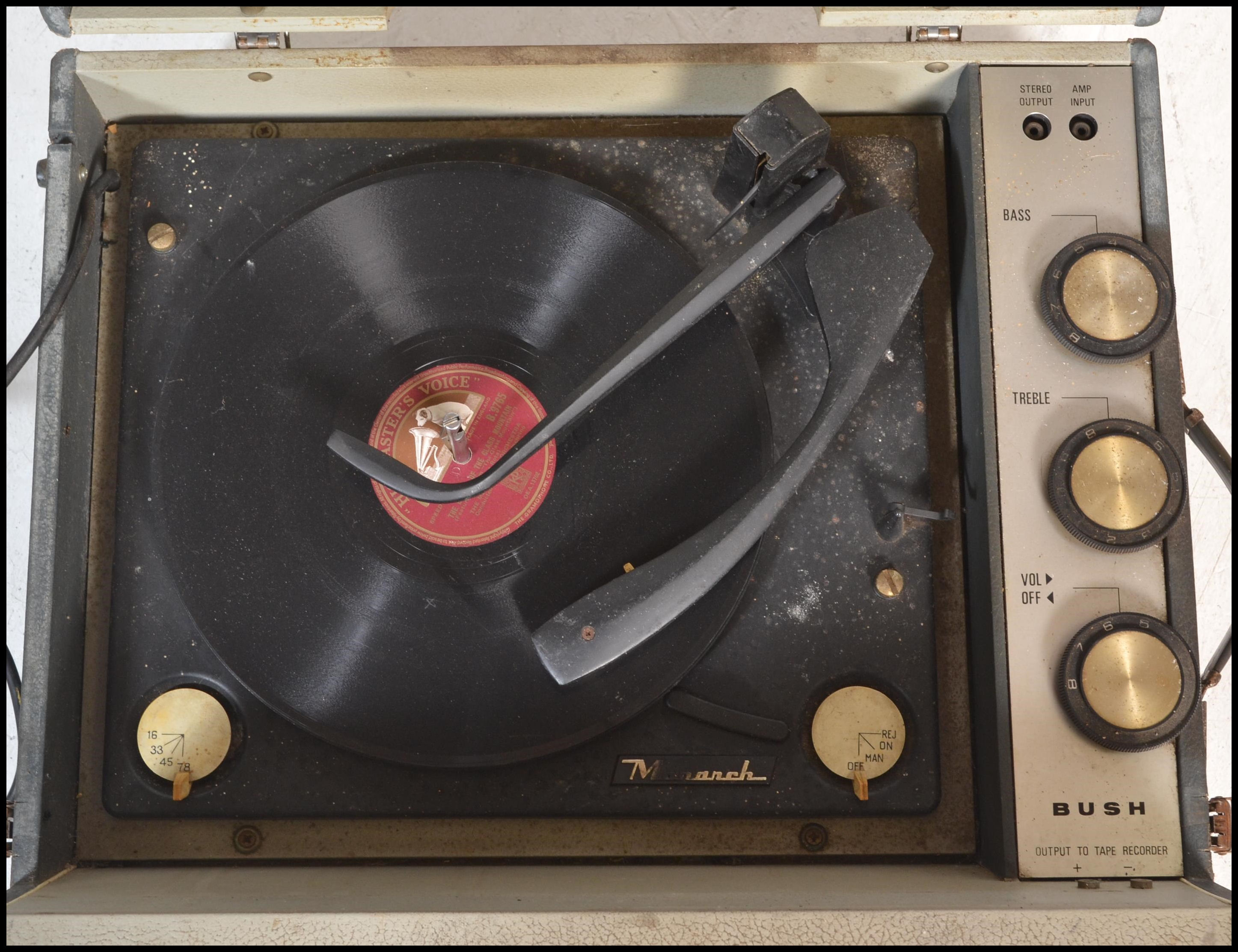 A vintage 20th Century portable record player by Bush, fitted with a four speed record deck by - Image 5 of 8