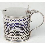 A decorative 19th Century Victorian silver hallmarked mustard pot having fret pierced decoration