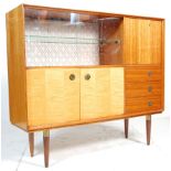 A good mid century Italian sideboard credenza in the manner of Gio Ponti. Raised on turned
