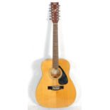 A good Yamaha FG-411-12 twelve string acoustic guitar having a white marked fretboard and chrome