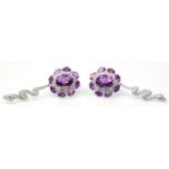 A pair of silver ladies dress earrings having a cluster of amethysts with drops in the form of