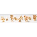 A group of twelve Harmony Kingdom resin animal figurines to include bush babies, owl, dolphin, duck,