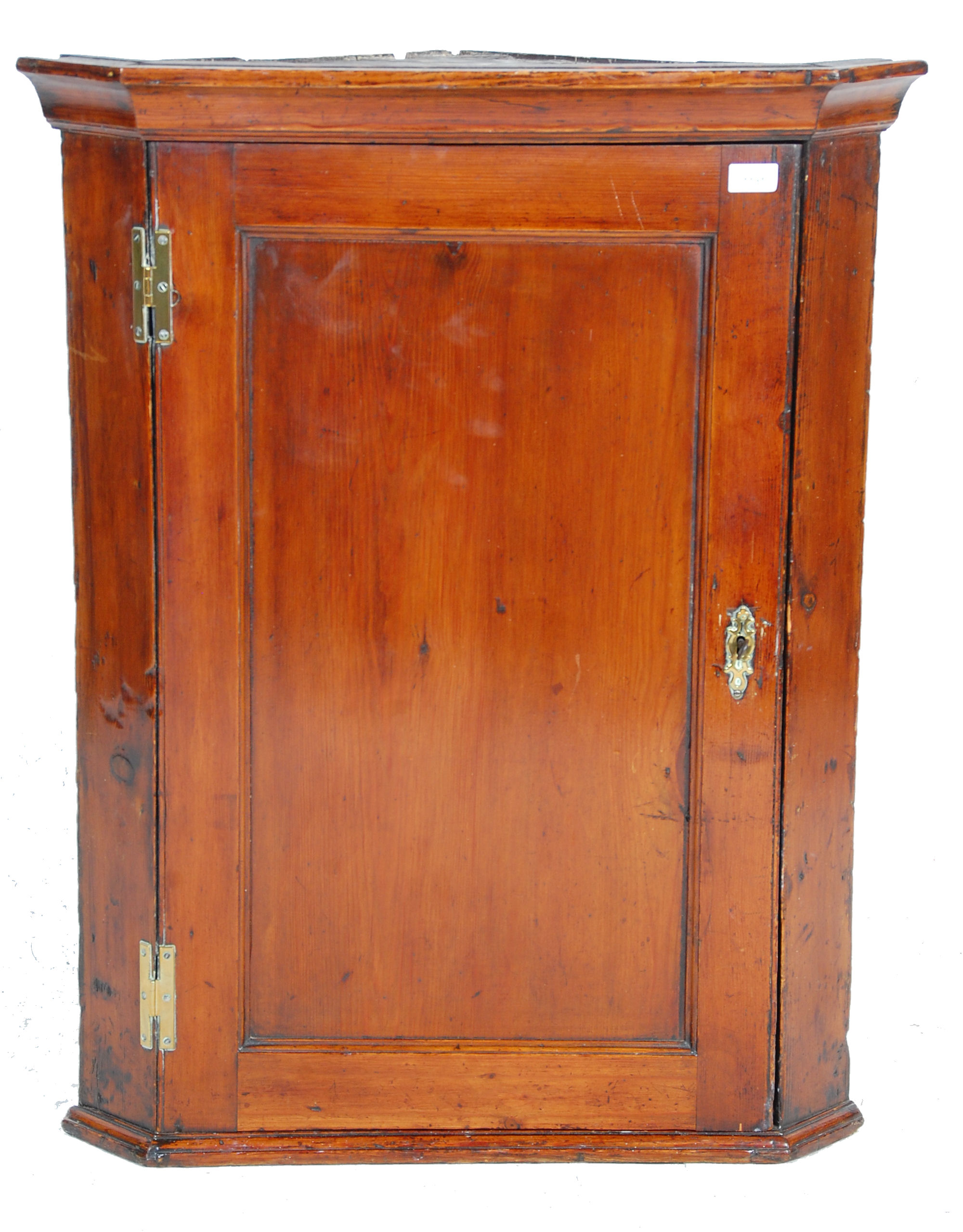 A 19th Century Georgian  / George III country pine hanging corner cabinet having a panelled door