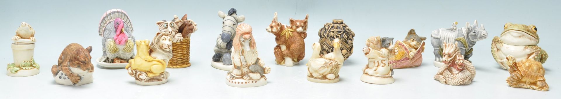 A group of sixteen resin Harmony Kingdom resin figurines to include red panda's, kitten in a