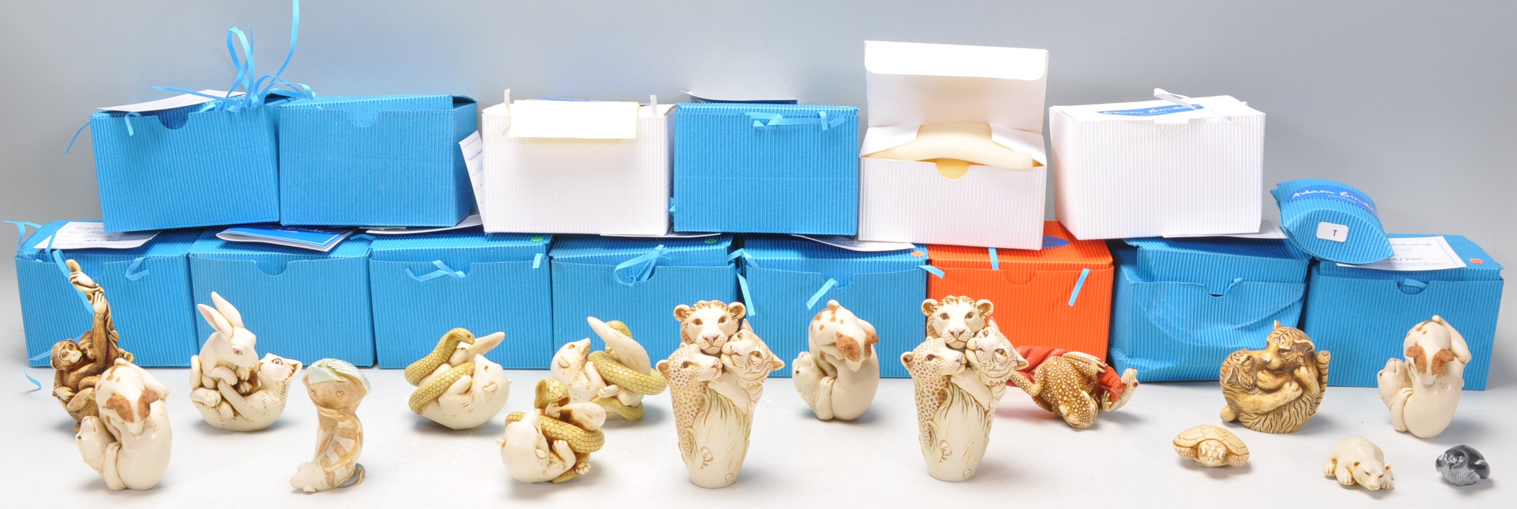 A group of sixteen Adam Binder carved resin netsuke style figures of the animal kingdom to