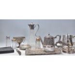 A good mix of silver plate wares dating form the early 20th Century to include a decorative floral